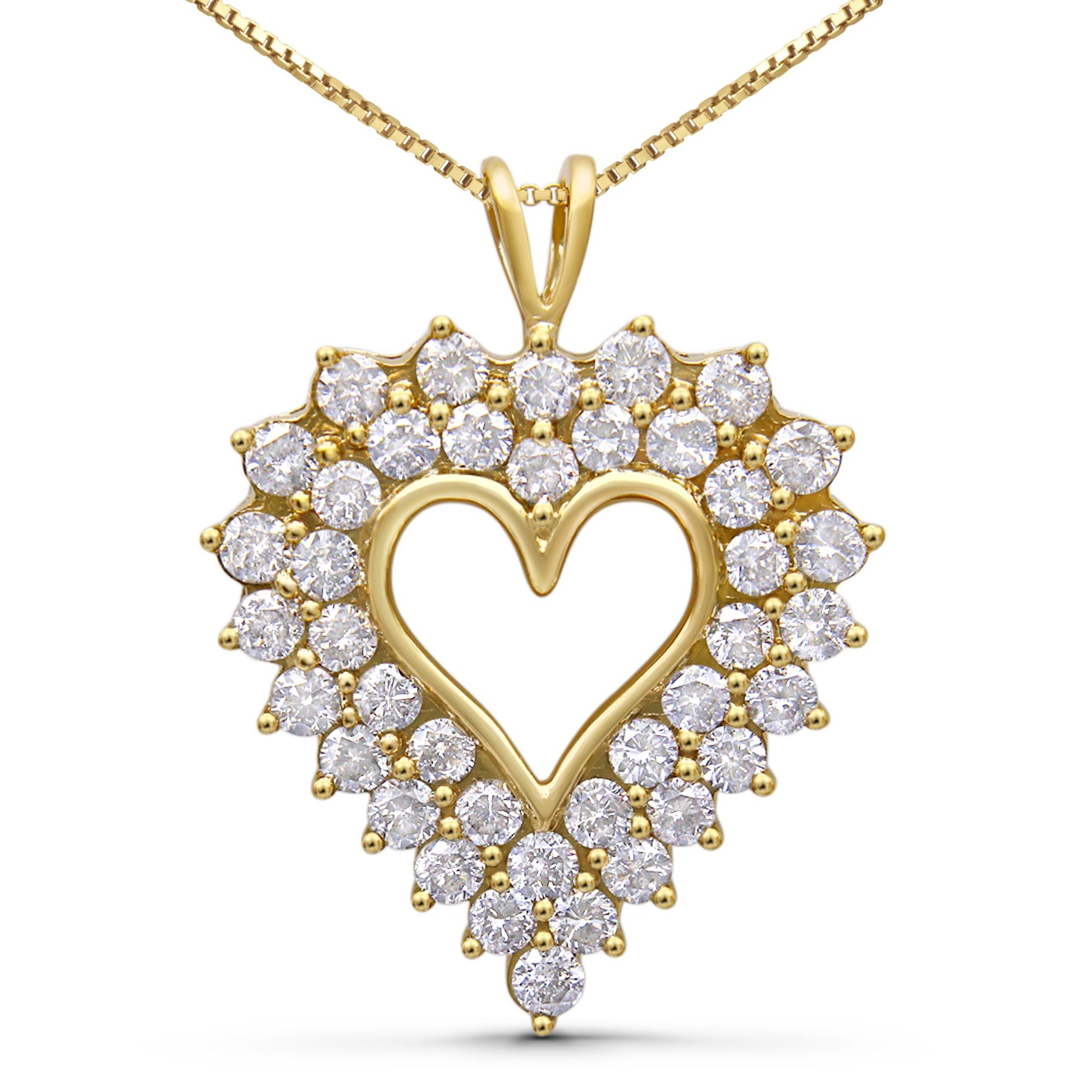 Front-facing view of a yellow metal heart-shaped pendant necklace with round white gemstones set in prong and channel settings creating a double heart outline.