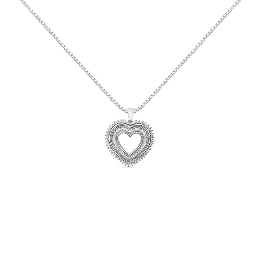 Front-facing shot of a white metal heart-shaped necklace pendant with two rows of prong-set white round and baguette-shaped gemstones, hanging from a chain.