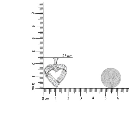Close-up front view of a white metal heart-shaped necklace pendant with channel set baguette-shaped white gemstones, displayed on a ruler and a coin for size reference.