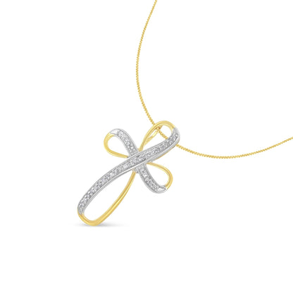 Front angled view of a yellow and white metal necklace pendant in an abstract cross shape, with a white gemstone pave setting along the white metal sections, hanging from a yellow metal chain.