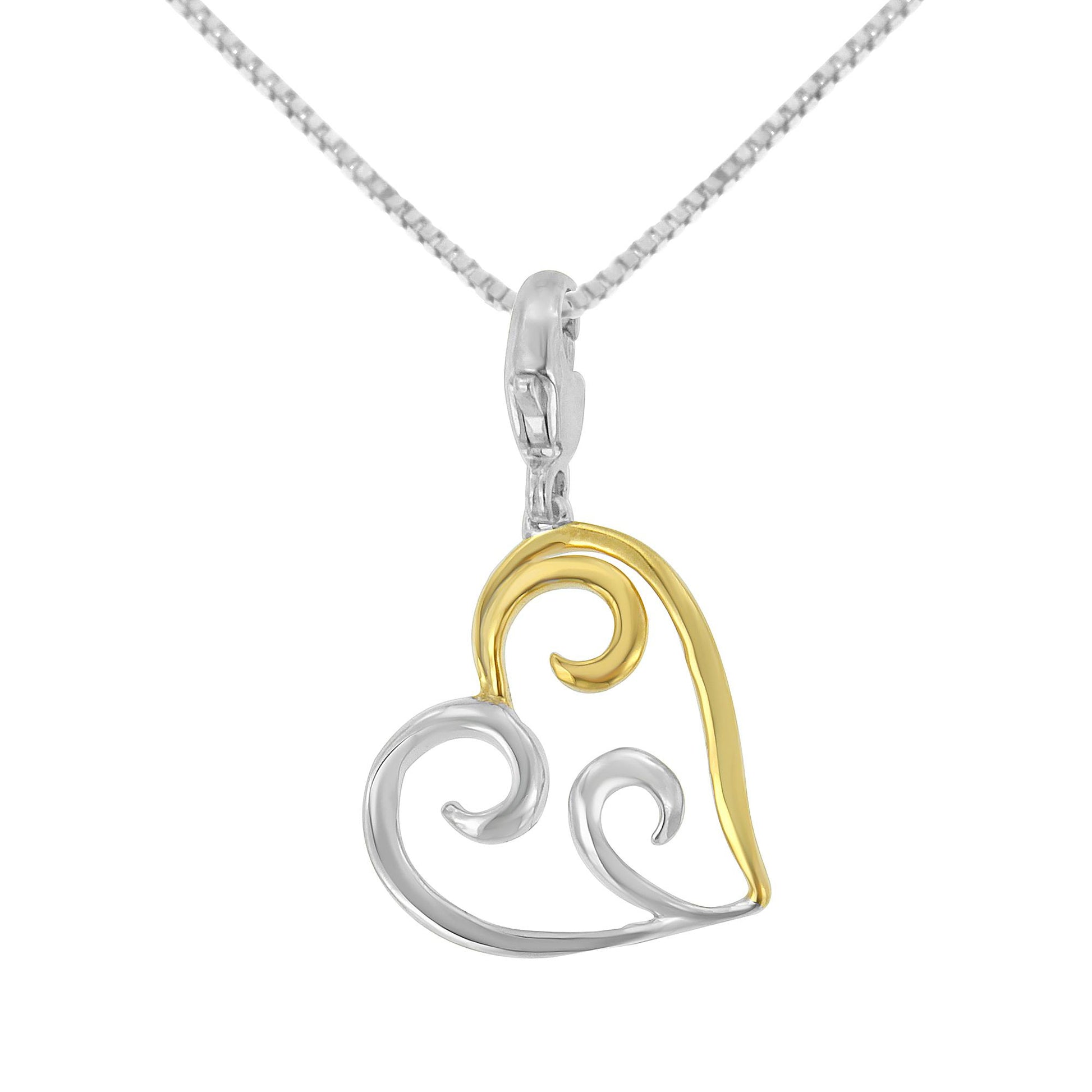 Front-facing view of a necklace with a heart-shaped pendant featuring yellow and white metal swirl designs.