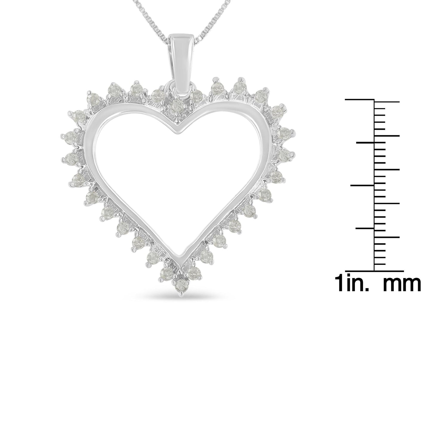 Front view of a white heart-shaped necklace pendant with round white gemstones in prong settings along the edges, shown with a ruler for size reference.