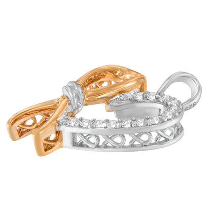 Close-up side angle of a two-toned necklace pendant with a bow design, featuring round white gemstones in prong settings.