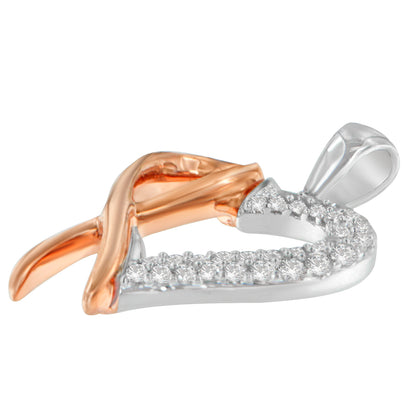 Close-up front angle of a heart-shaped necklace pendant with intertwined yellow and white metal sections, the white metal side adorned with round white gemstones in prong settings.