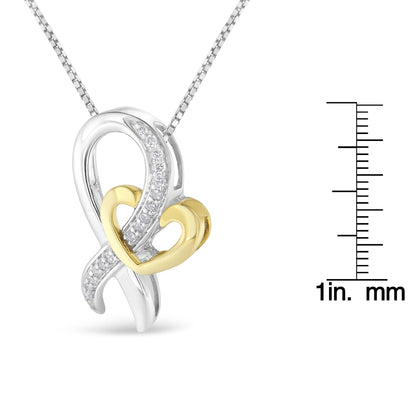 Two-toned necklace pendant with intertwined looping design featuring a row of white round gemstones in prong settings, photographed from a front angle with a ruler for size reference.