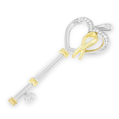 Two-toned key-shaped necklace with a heart top adorned with prong-set white round gemstones, shown at a slight angle on a white background.