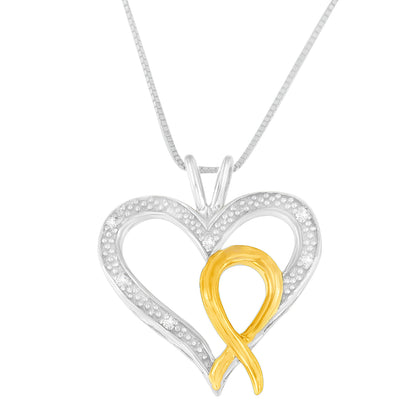 Front view of two-toned heart-shaped necklace pendant with an open design, featuring a yellow ribbon detail and scattered white round prong-set gemstones, hanging on a chain.