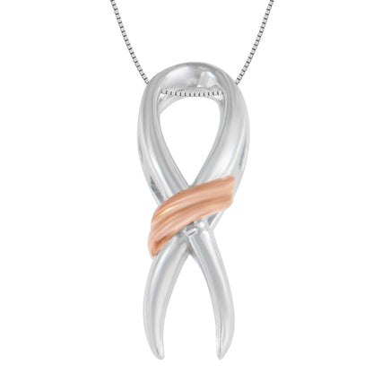 Front view of two-toned metal necklace pendant shaped like an infinity symbol with a diagonal smooth band across the center.