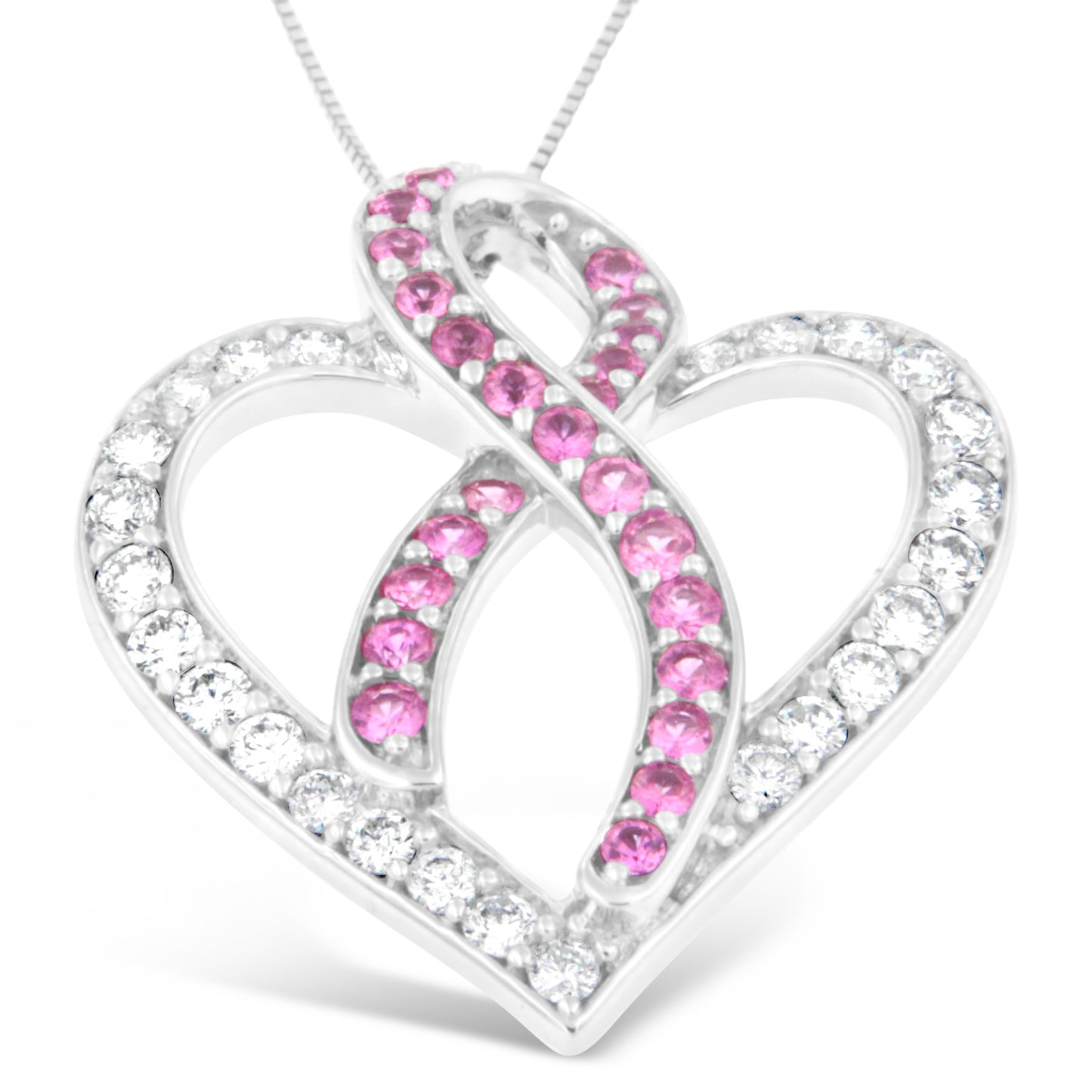 Close-up front angle of a white metal heart-shaped necklace pendant with alternating rows of round white gemstones and round pink gemstones in prong settings.