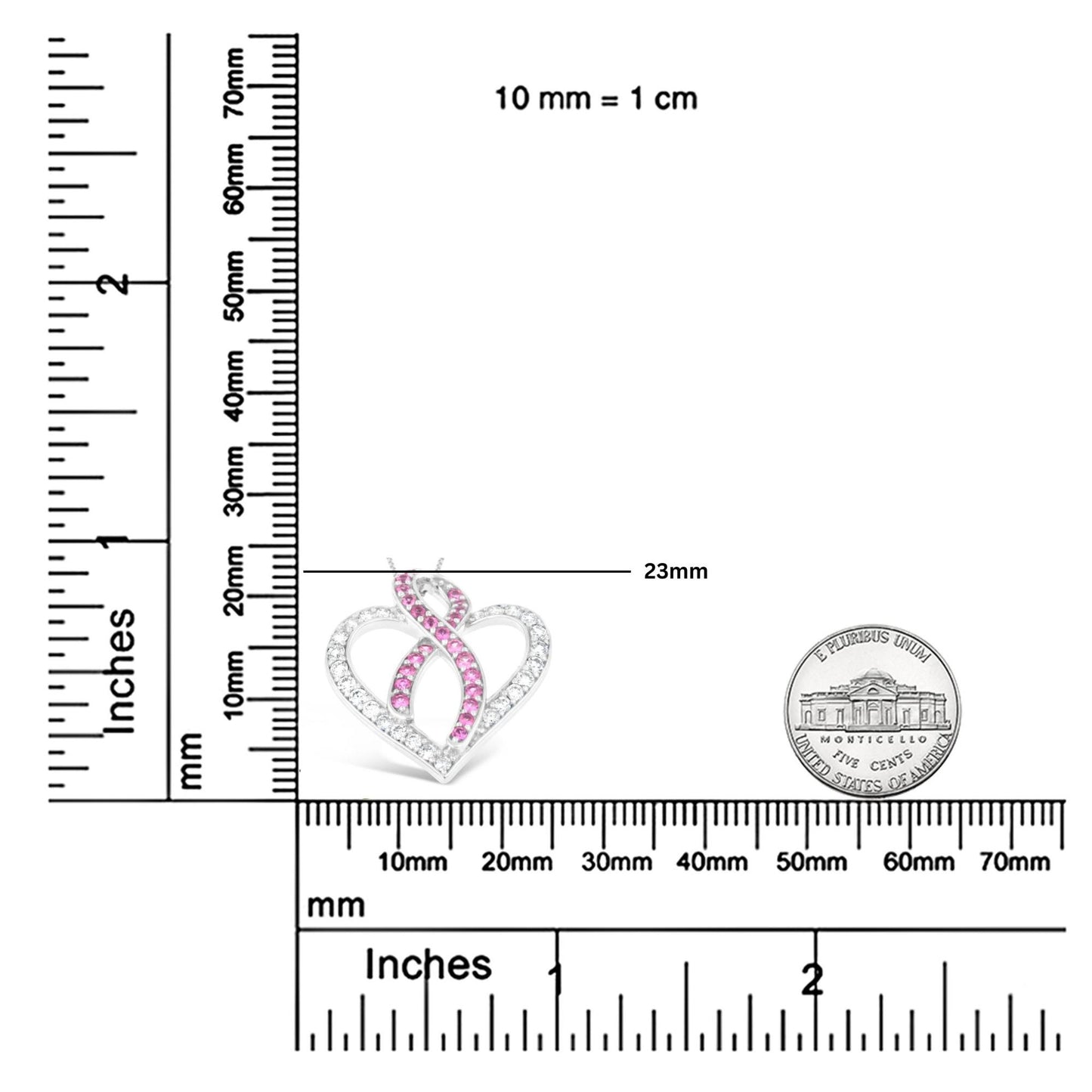 Close-up front view of a white necklace pendant in an open heart shape with intertwined ribbon design, featuring round white and pink gemstones in prong settings, placed on a ruler for size reference.