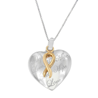 Front angle of a two-toned heart-shaped necklace pendant with engraved words and a gold-toned ribbon design on a silver-toned chain.