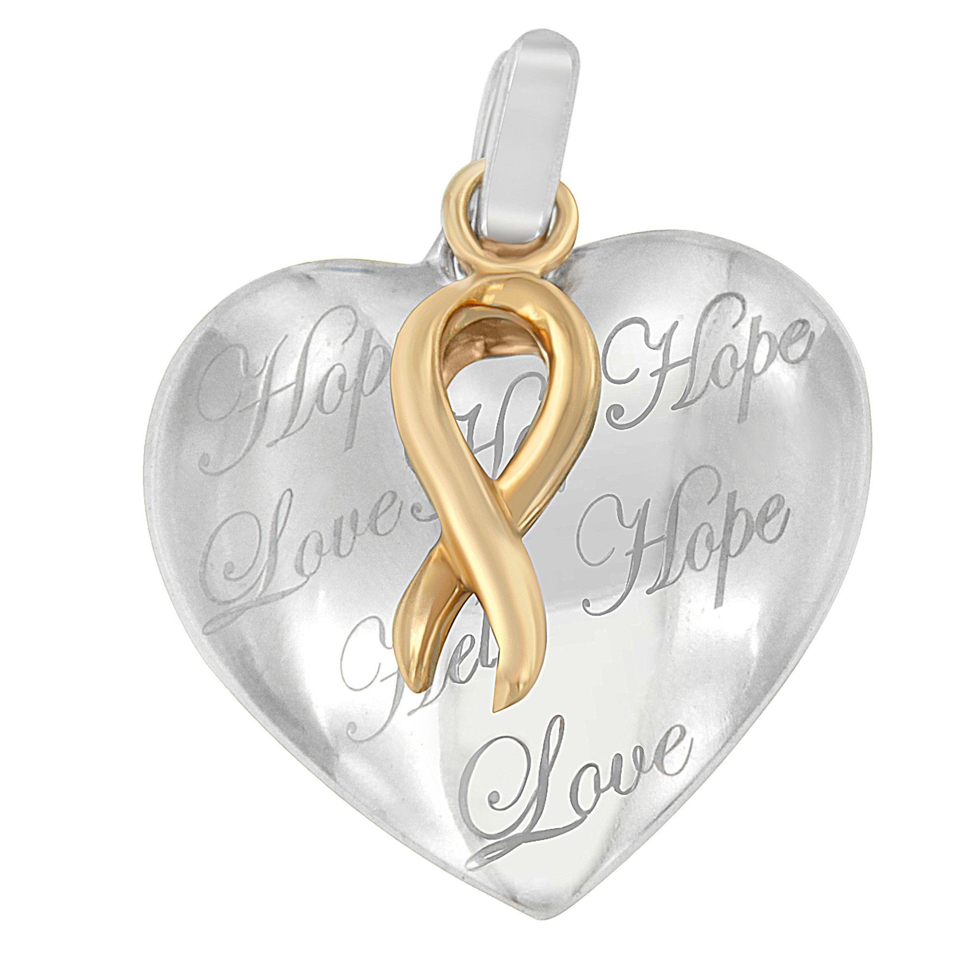 Close-up front angle of a two-toned heart-shaped necklace pendant with engraved words and a gold-toned ribbon detail.