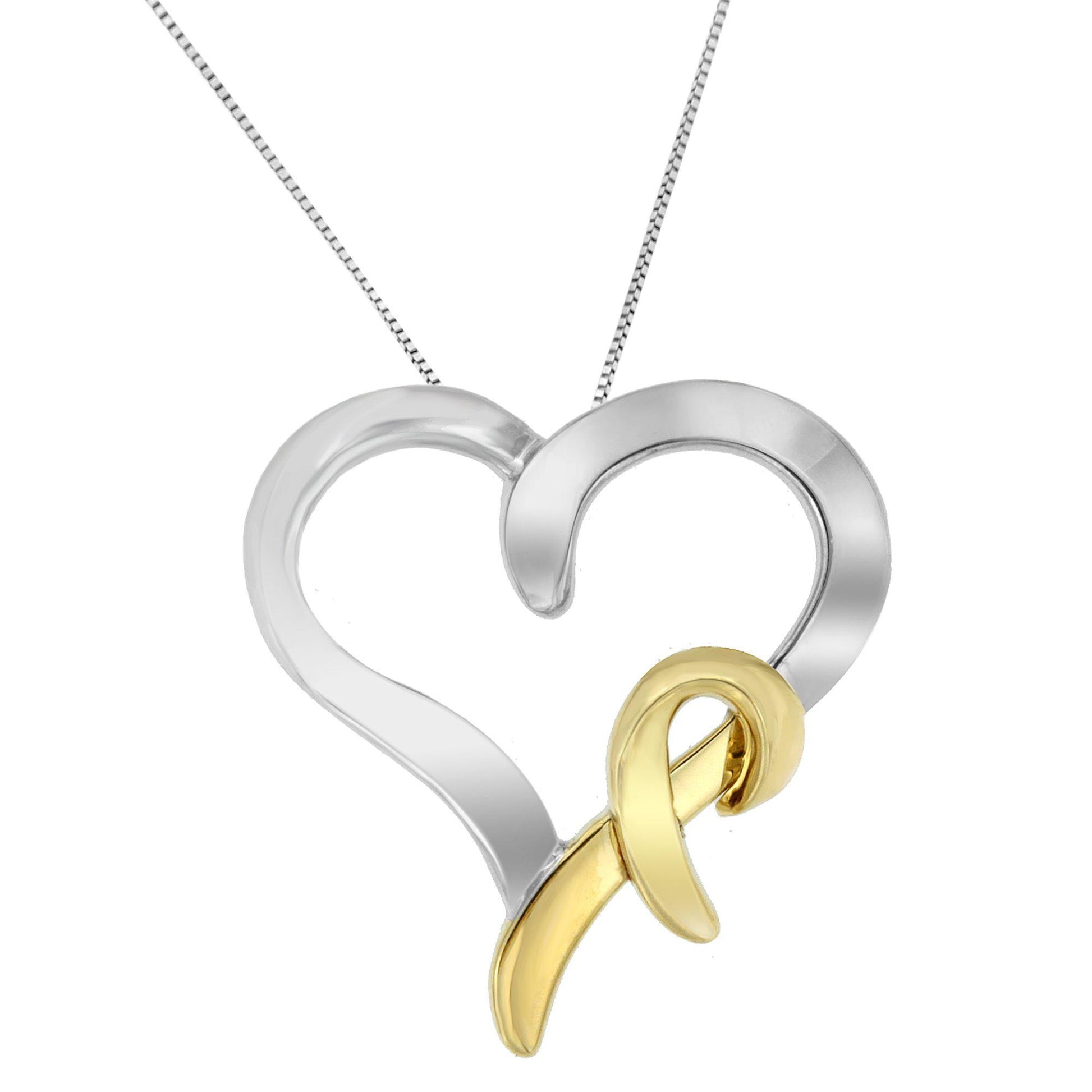 Close-up front view of a two-toned heart-shaped necklace pendant with a looped ribbon design overlay.