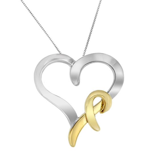 Close-up front view of a two-toned heart-shaped necklace pendant with a looped ribbon design overlay.