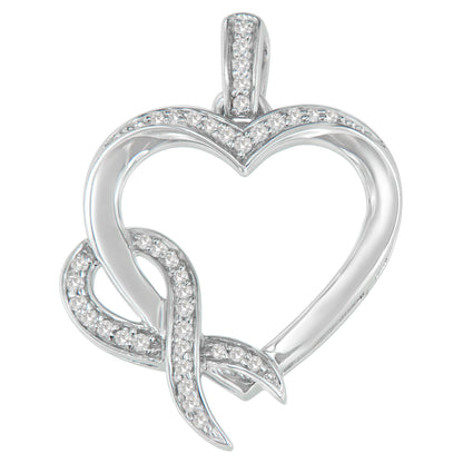 Front angled view of a white metal heart-shaped necklace pendant featuring a curling ribbon design partially encrusted with white round prong-set gemstones.
