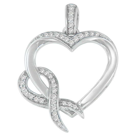 Front angled view of a white metal heart-shaped necklace pendant featuring a curling ribbon design partially encrusted with white round prong-set gemstones.