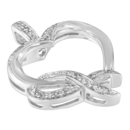 Close-up angled view of a white metal necklace pendant featuring an intertwined infinity design with prong-set round white gemstones.