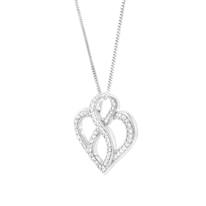 Front-facing shot of a white metal heart-shaped necklace pendant with intertwined design, adorned with multiple round white gemstones in prong settings, hanging from a chain.