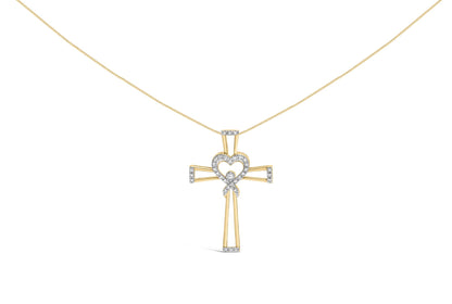 Yellow metal cross-shaped necklace pendant with a heart and ribbon design adorned with white round prong-set gemstones, front view.