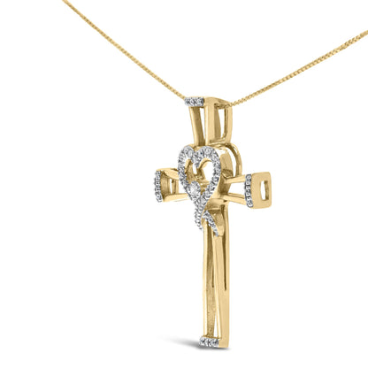 Yellow metal cross pendant necklace with white round gemstones in prong settings, featuring a heart-shaped design in the center, shown at a slight angle.