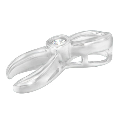 Close-up side angle of a white metal necklace pendant setting with a single round white gemstone in a prong setting.