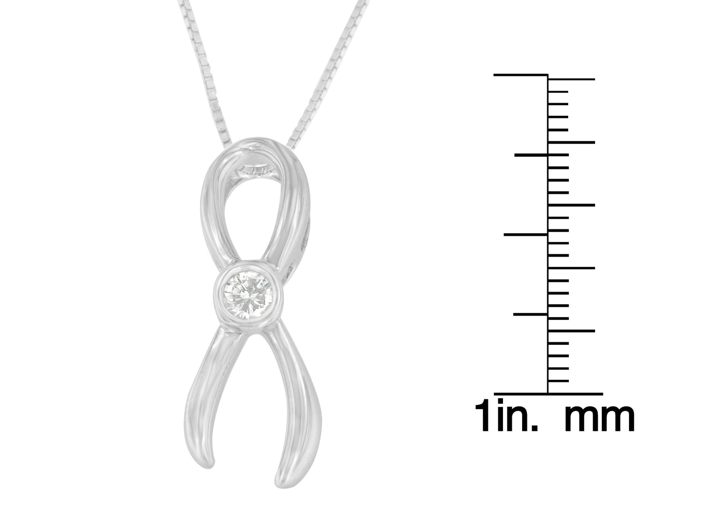 Close-up front view of a white metal infinity-shaped necklace pendant with a round white gemstone in the center, shown next to a scale for size reference.