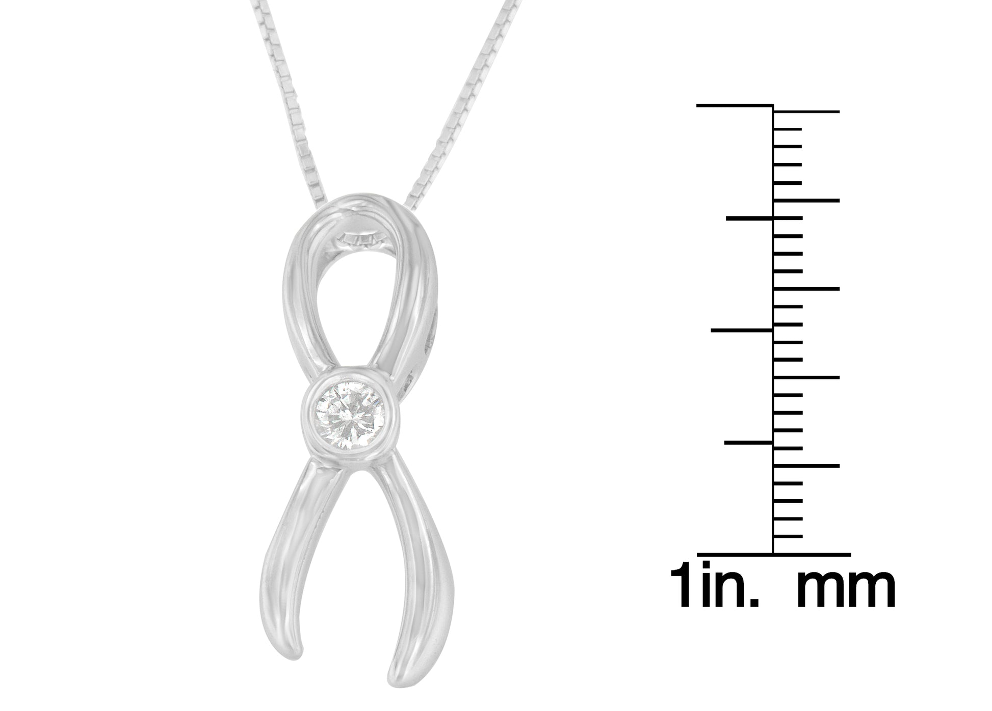Close-up front view of a white metal infinity-shaped necklace pendant with a round white gemstone in the center, shown next to a scale for size reference.