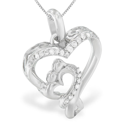 Close-up front angled view of a white metal heart-shaped necklace pendant with multiple small round white gemstones in prong settings along the outer and inner edges.