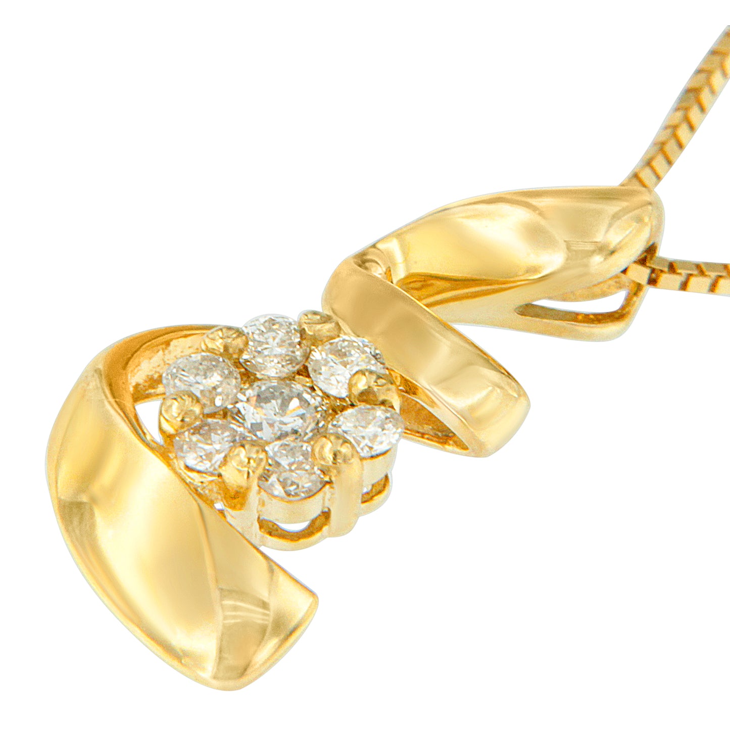 Close-up angled view of a yellow metal necklace pendant with a cluster of round white gemstones in prong settings.