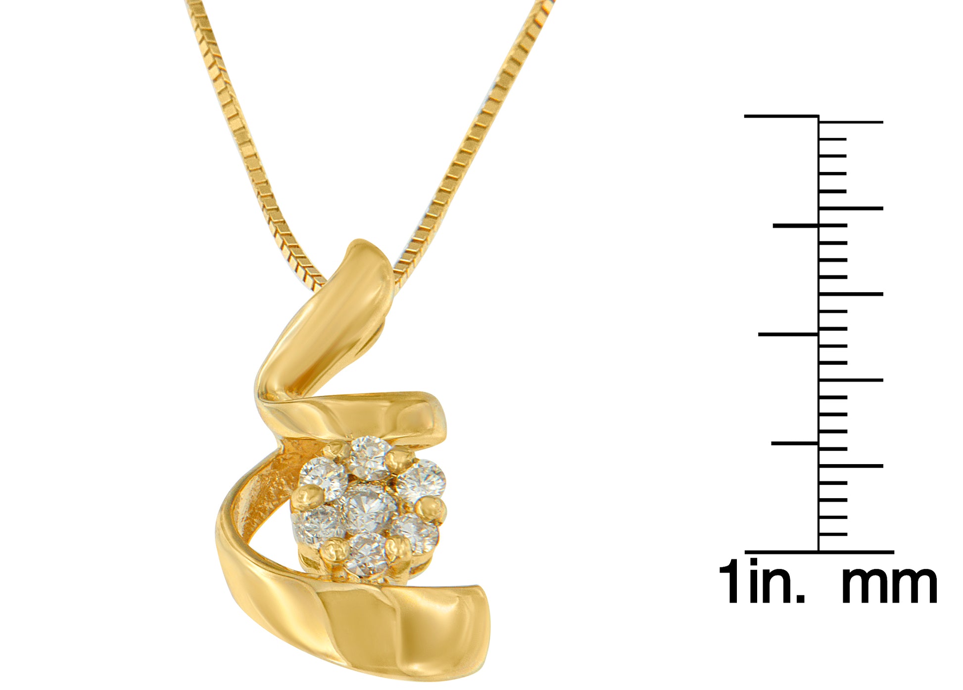 Yellow metal necklace pendant with seven round white gemstones in prong settings, shown in a close-up front angle with a ruler for size reference.