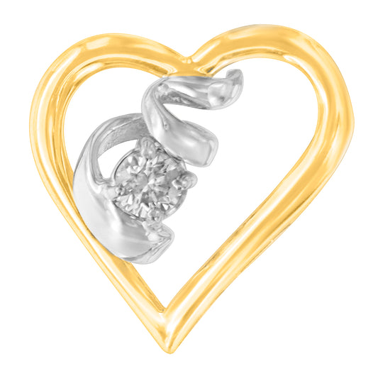 Close-up front view of a heart-shaped yellow and white metal necklace pendant with a round white gemstone set in prongs inside the heart.