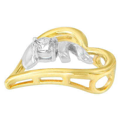 Close-up shot of a heart-shaped necklace pendant with yellow and white metal, featuring a single round white gemstone in a prong setting.