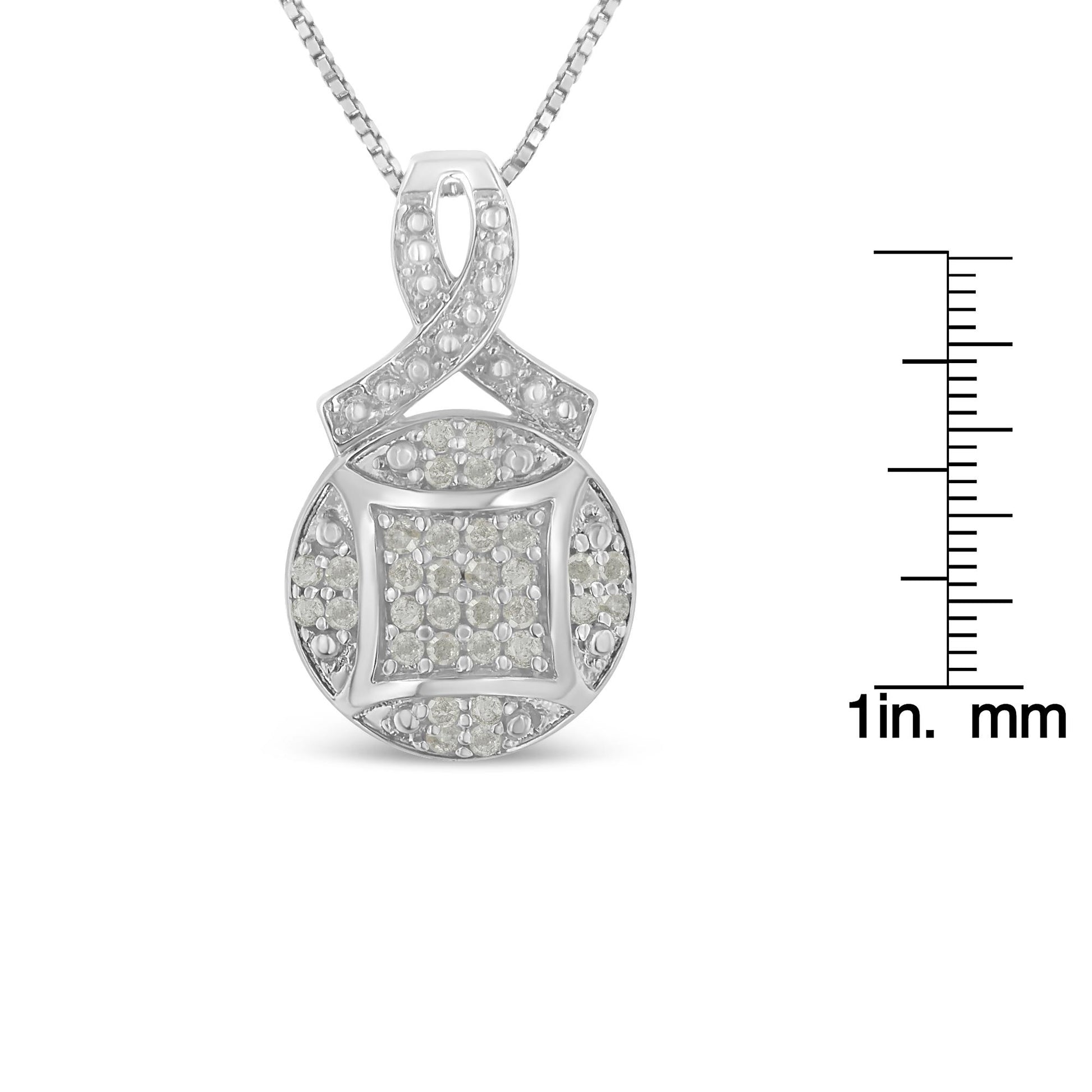 Front angle of white metal necklace with a pendant featuring round pave-set white gemstones, shown with ruler for size reference.