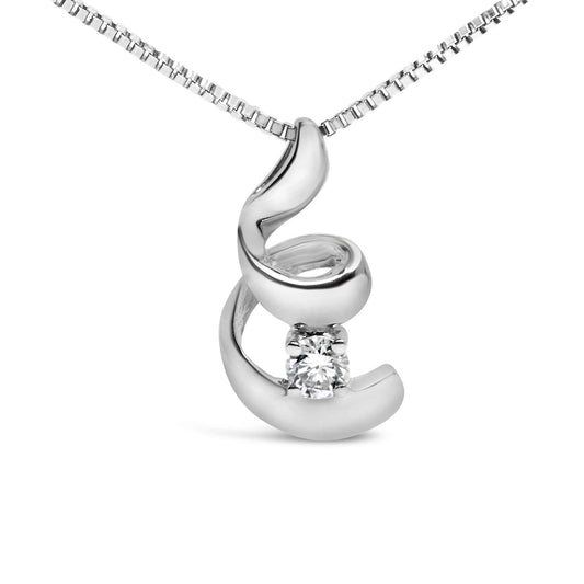 Close-up front angle of a white metal necklace pendant with a fluid, abstract swirl design holding a single round white gemstone in a four-prong setting.