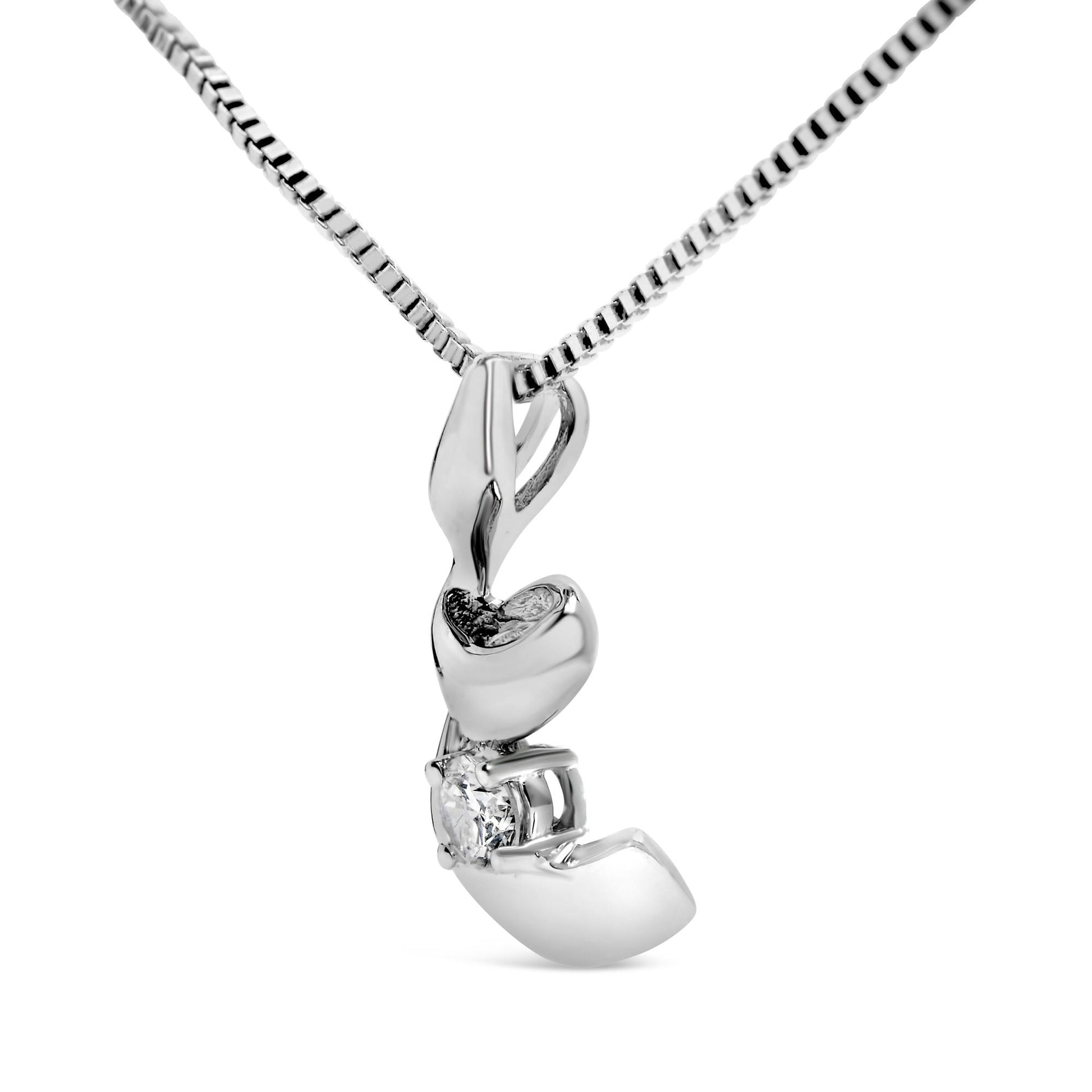 Close-up front angle of a white necklace with a curved pendant featuring a round white gemstone in a four-prong setting.