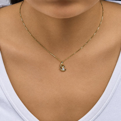 10K yellow gold spiral diamond pendant necklace shown on a model