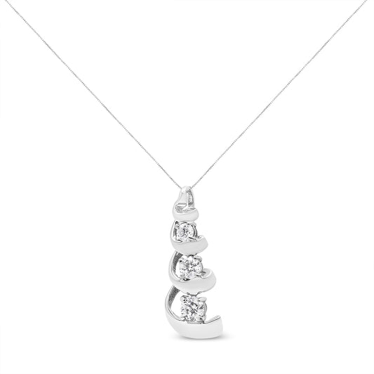 Front angle view of a white metal necklace with a pendant featuring three round white gemstones in prong settings.