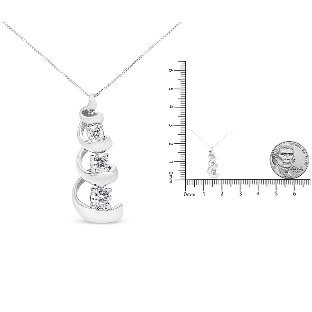 White metal necklace with three round white gemstones in prong settings, shown in a front-facing close-up and a smaller image on a ruler and with a coin for size reference.