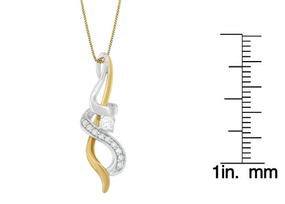 Close-up front angle of a two-tone necklace pendant with intertwining yellow and white metal strands, featuring round prong-set white gemstones, displayed next to a ruler for size reference.
