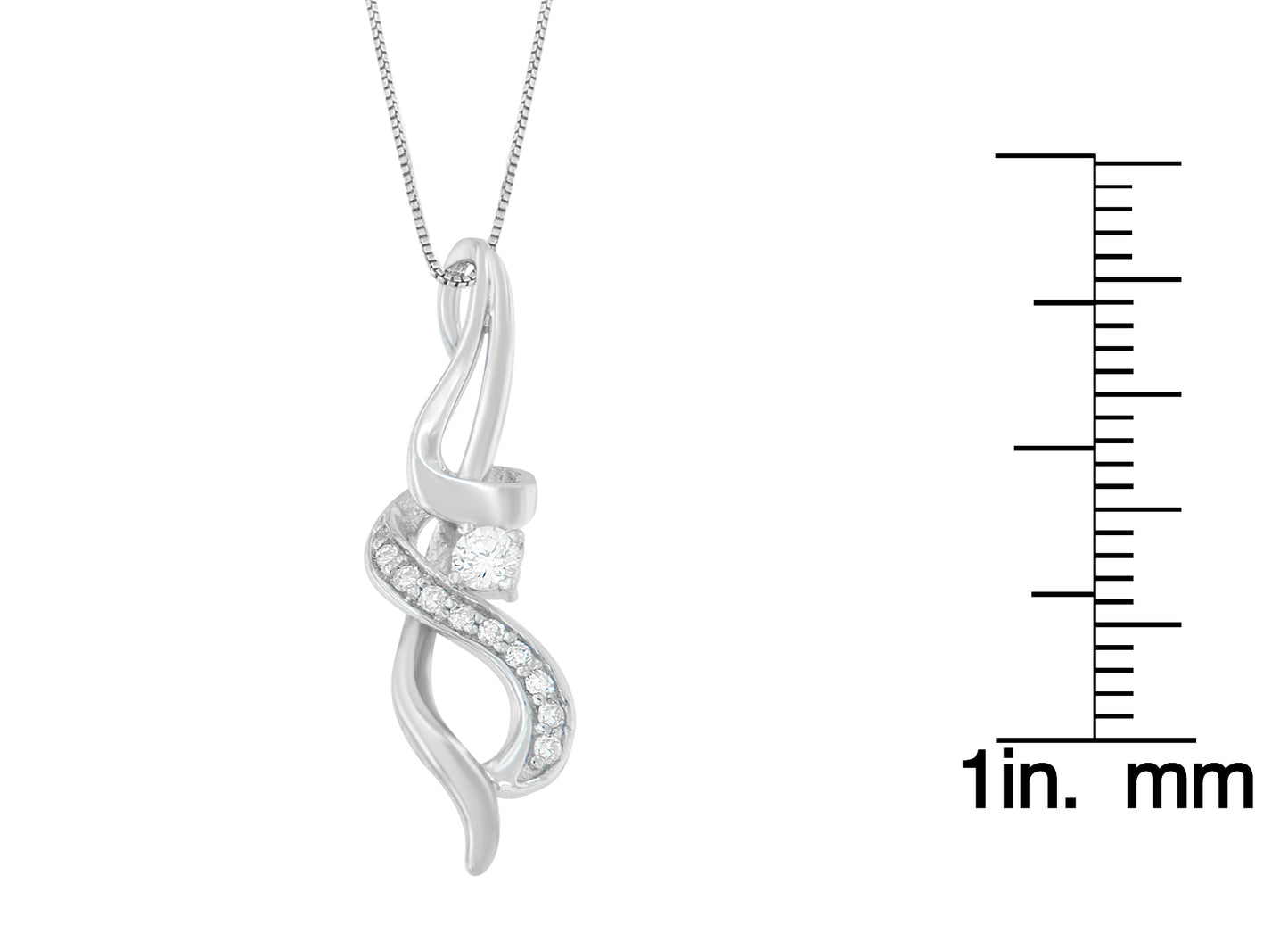 White metal necklace pendant with a twisted design featuring round white gemstones in prong settings, photographed straight on with a size ruler to the right.