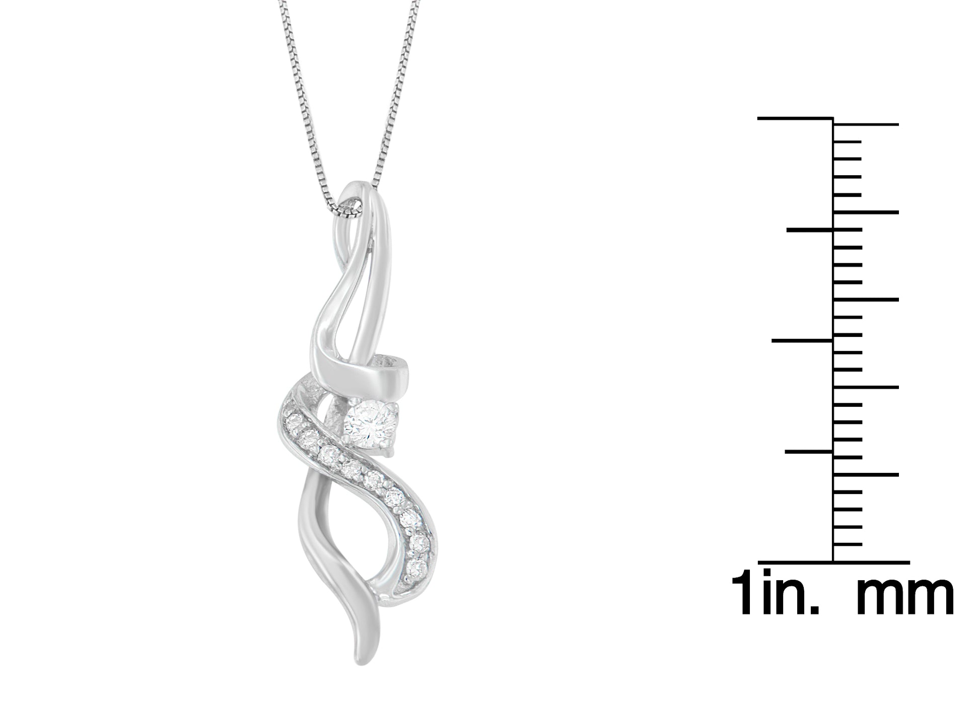 White metal necklace pendant with a twisted design featuring round white gemstones in prong settings, photographed straight on with a size ruler to the right.