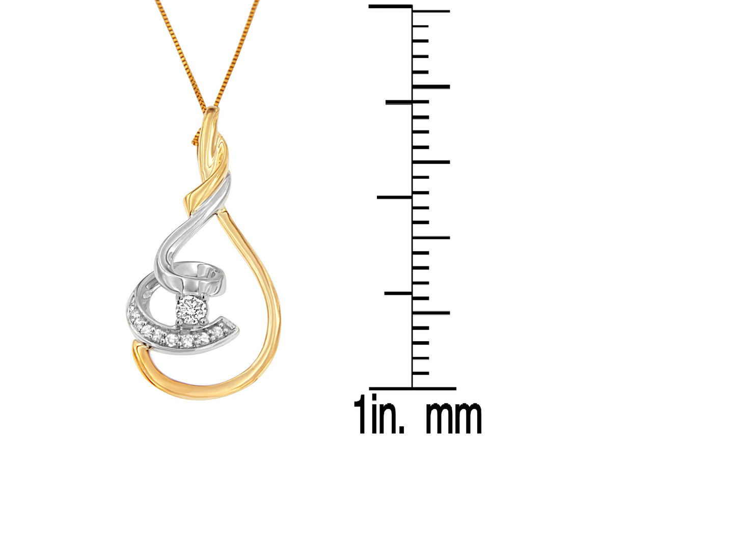 Two-toned necklace pendant with curved design and round white gemstones in prong settings, photographed in a front view with a ruler for size reference.