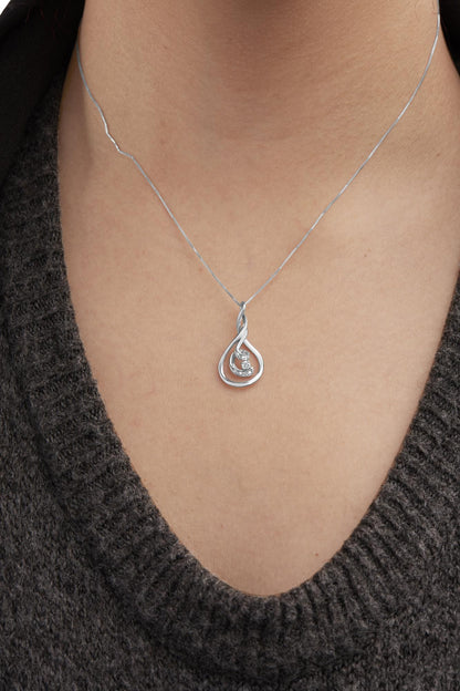 White metal necklace with a pendant featuring a teardrop shape and white gemstones, shown on a model from the front angle.