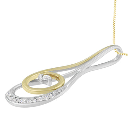 Close-up angled view of a two-toned necklace pendant featuring round white gemstones in a prong setting along an open teardrop and circular design on a chain.