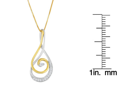 Two-toned necklace pendant with intertwined swirl design featuring round white gemstones in prong settings, shown hanging with a ruler for size reference.