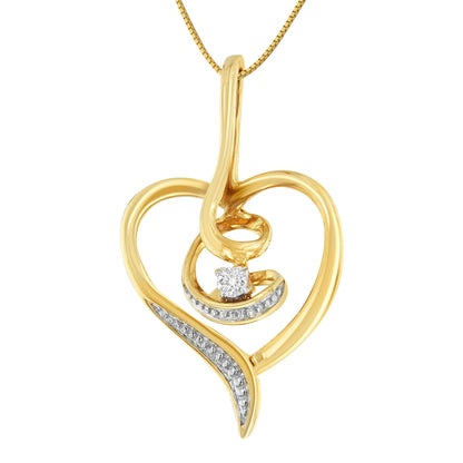 Front view of a yellow metal heart-shaped necklace pendant with a single white round gemstone in prong setting and additional small white gemstones accenting one side.