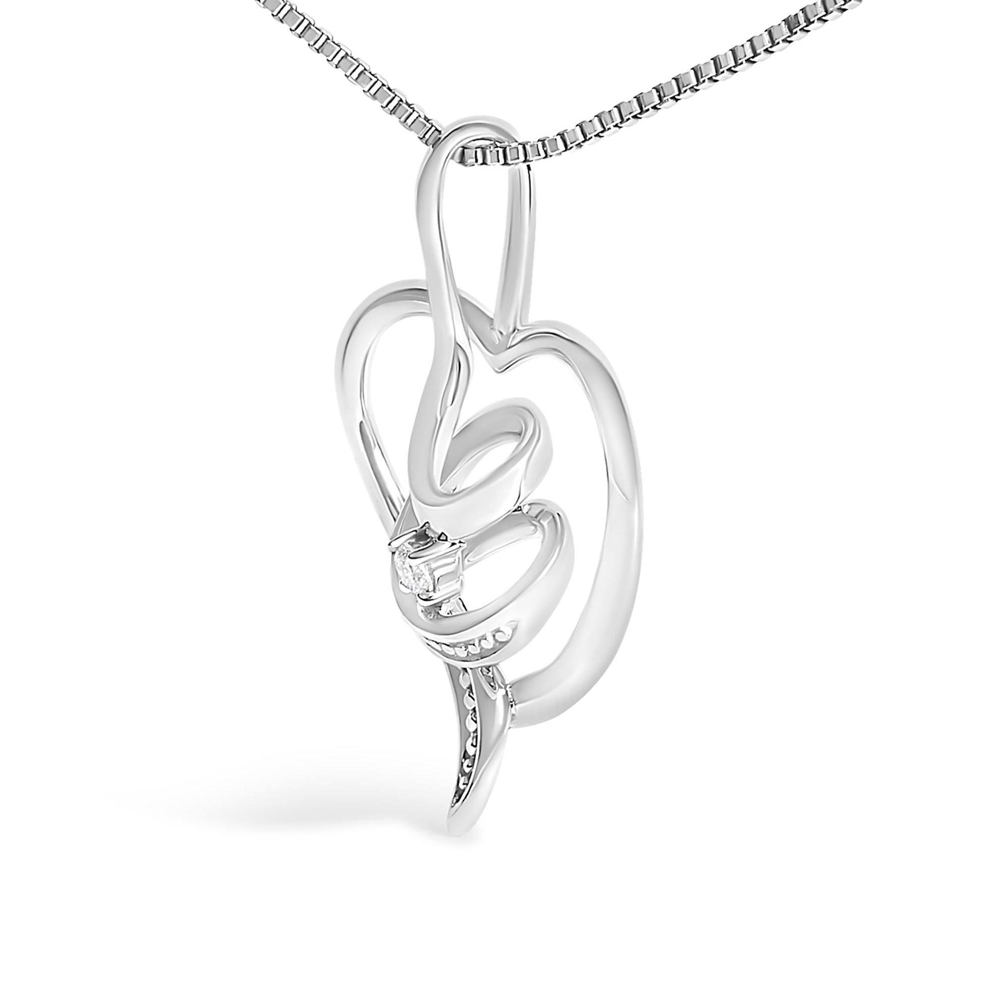 Close-up angled view of a white metal necklace pendant featuring an abstract hand design holding a single round white gemstone in prong setting.