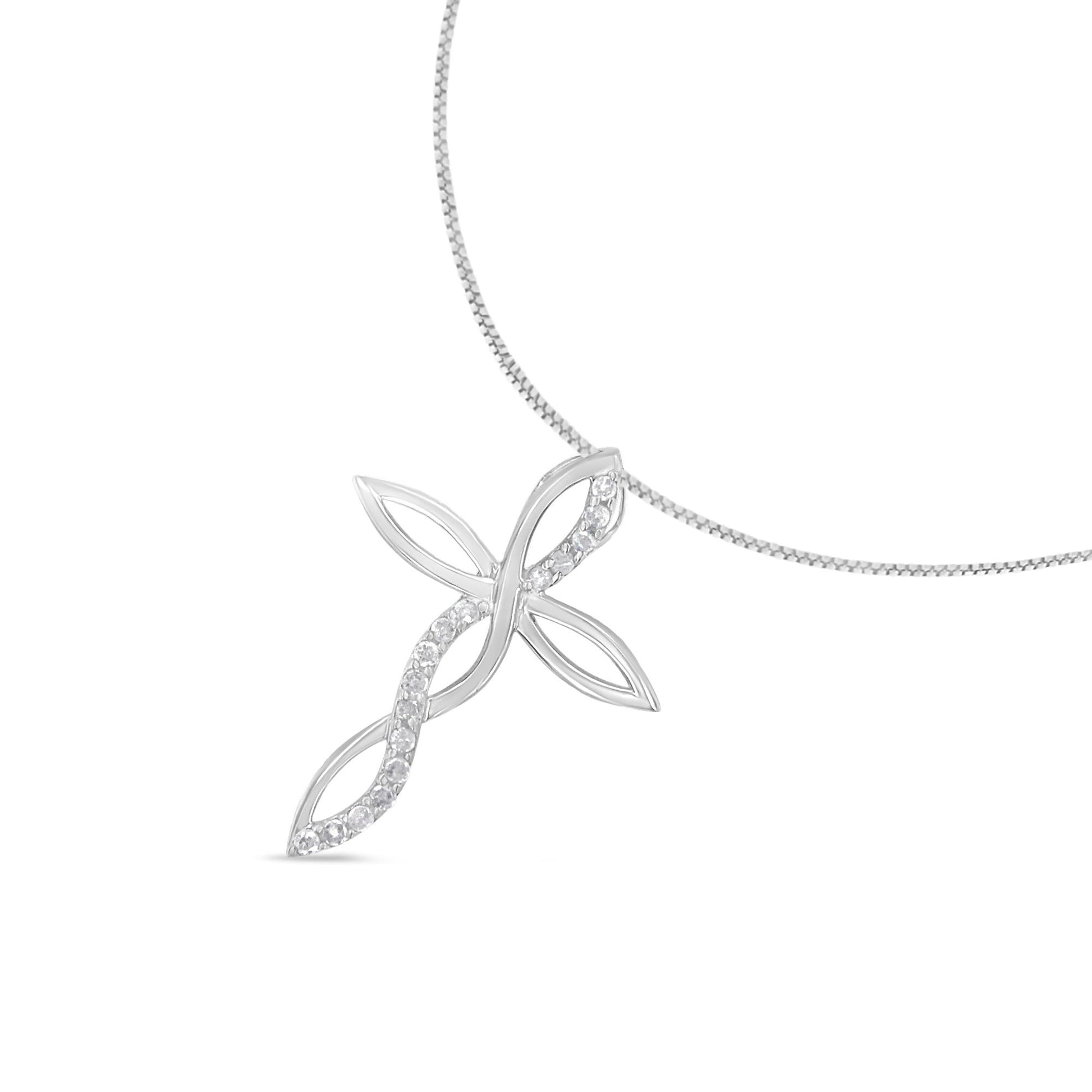 White metal necklace with a cross pendant featuring an open design with prong-set round white gemstones, shot from a front angle against a white background.