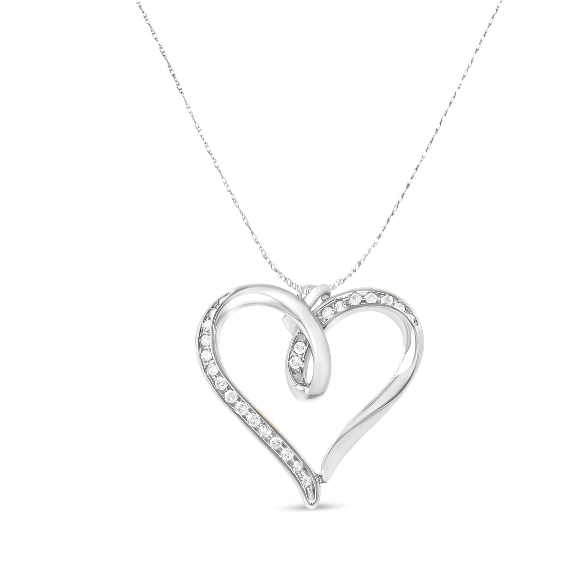 Front view of a white metal heart-shaped necklace pendant with an open design, partially adorned with white round prong-set gemstones, suspended on a chain against a white background.