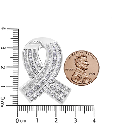 Close-up front angle of a white metal necklace pendant shaped like a ribbon, adorned with channel-set round and baguette white gemstones, displayed on a ruler and next to a penny for size reference.